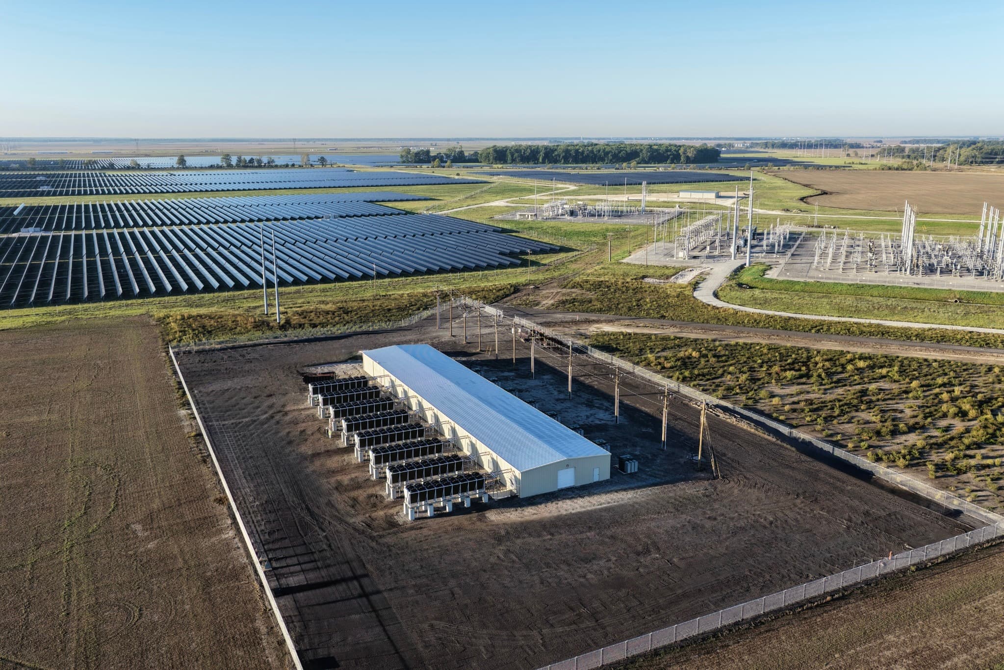Aerial view of the Driver Facility with cooling equipment, nearby solar panels, and electrical infrastructure