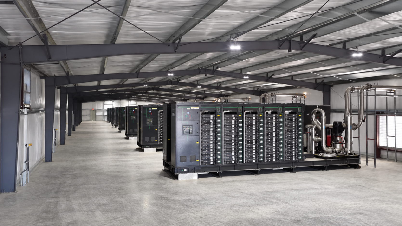 Rows of industrial racks receding into shadow